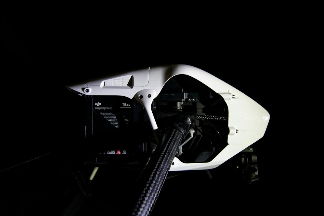 Professional broadcast camera on a tripod in a television studio with studio lights